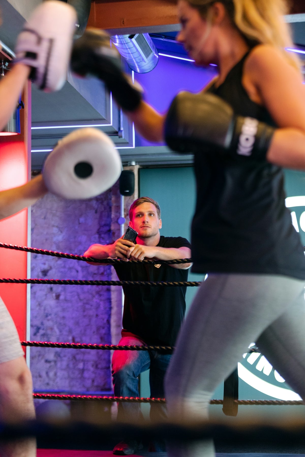 man in black t-shirt and gray pants